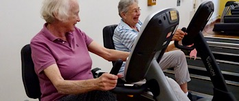 ladies in gym on bike